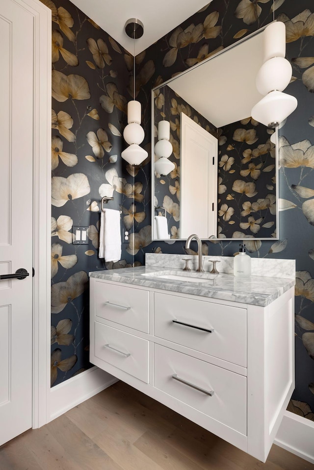 bathroom with vanity and hardwood / wood-style floors