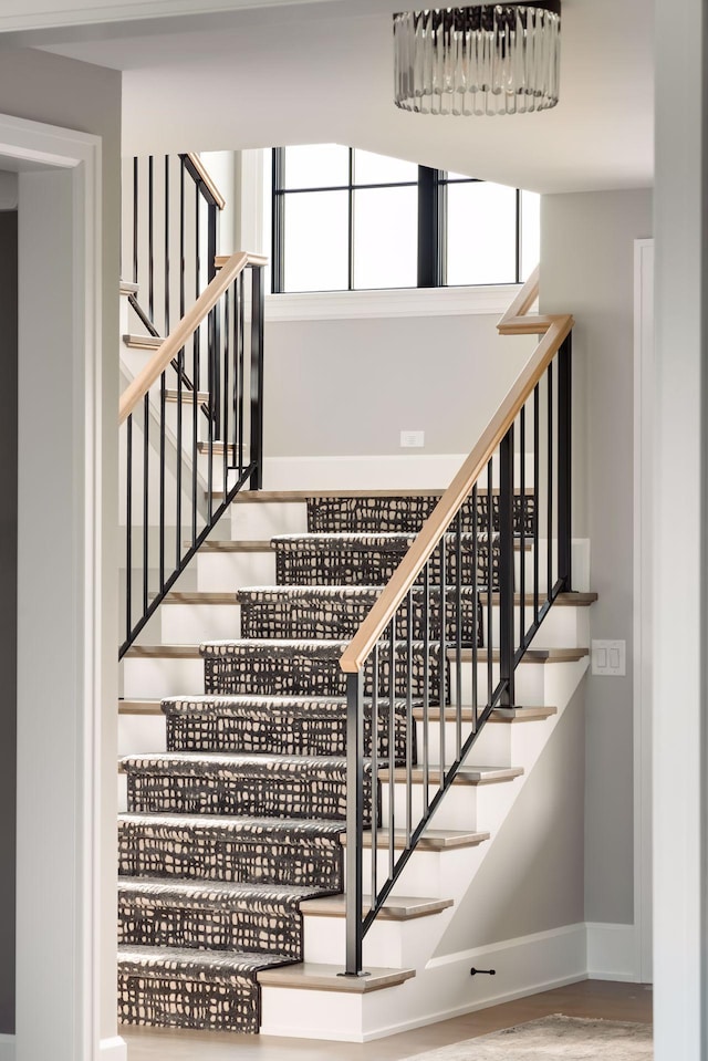 stairway featuring hardwood / wood-style flooring