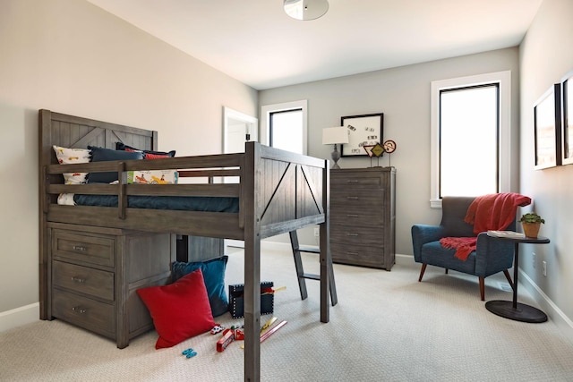 bedroom with light colored carpet