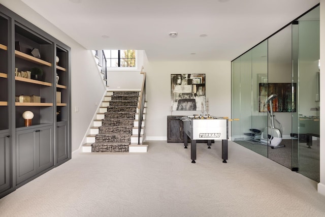 interior space featuring carpet flooring and built in features