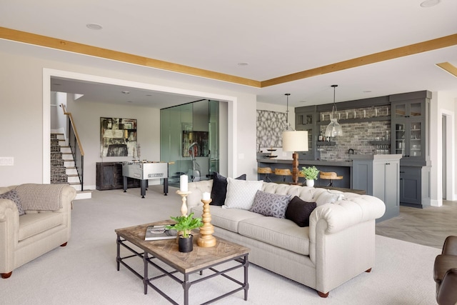 living room featuring a tray ceiling