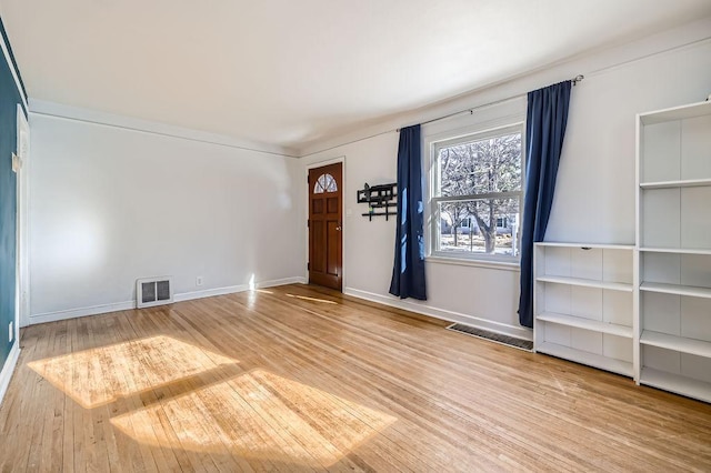 foyer entrance featuring hardwood / wood-style floors