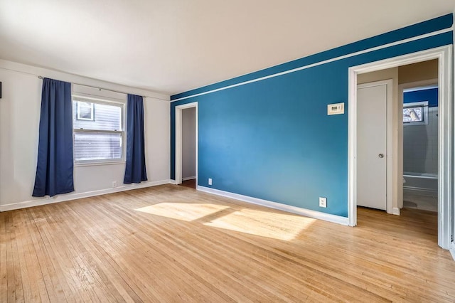 empty room with light wood-type flooring