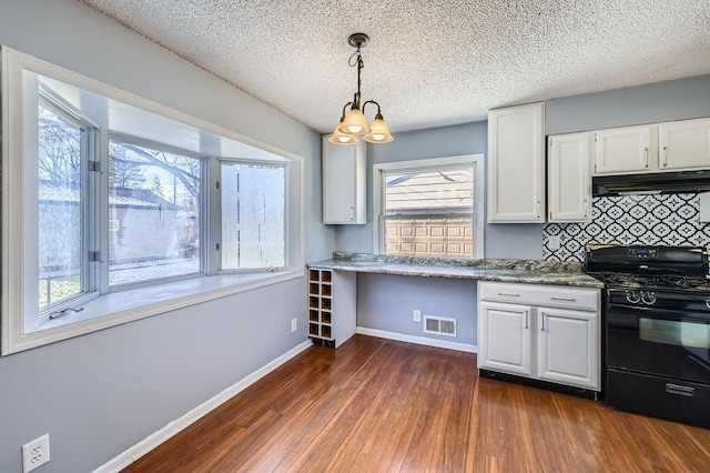 kitchen with white cabinetry, tasteful backsplash, decorative light fixtures, dark hardwood / wood-style flooring, and black gas stove