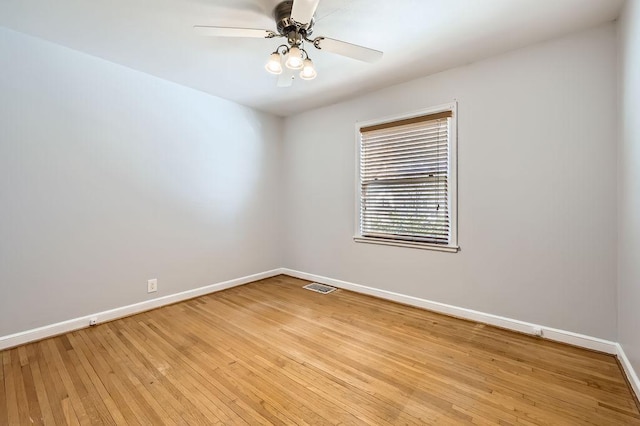 spare room featuring ceiling fan and light hardwood / wood-style floors