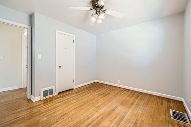 unfurnished room featuring light hardwood / wood-style floors and ceiling fan