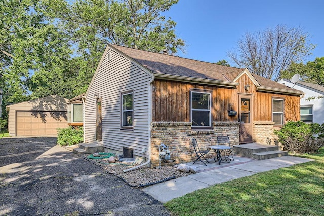 view of front of house featuring an outbuilding and a garage