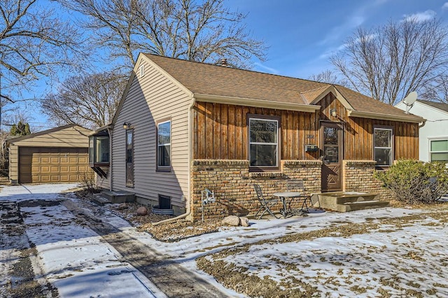 view of front of house with a garage and an outdoor structure