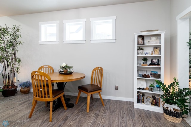 dining area with dark hardwood / wood-style floors