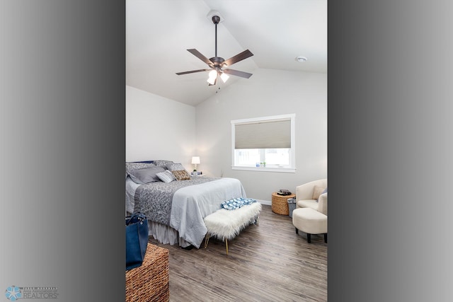 bedroom with hardwood / wood-style flooring, vaulted ceiling, and ceiling fan