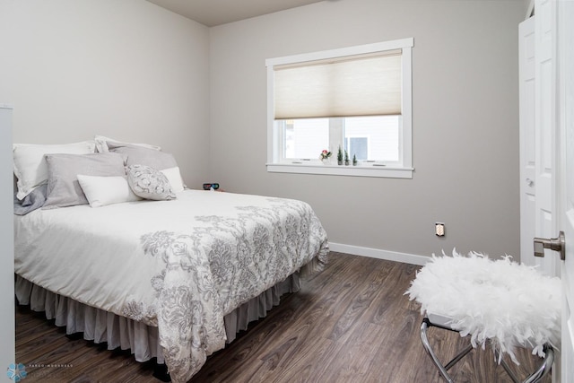 bedroom featuring dark hardwood / wood-style flooring