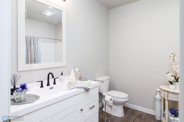 bathroom featuring a shower with curtain, vanity, toilet, and wood-type flooring