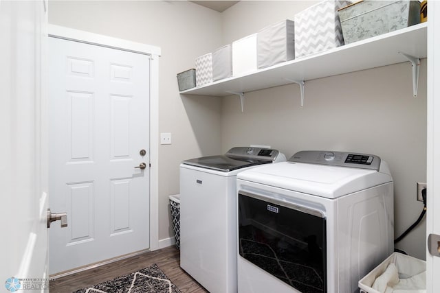 clothes washing area with dark hardwood / wood-style flooring and independent washer and dryer