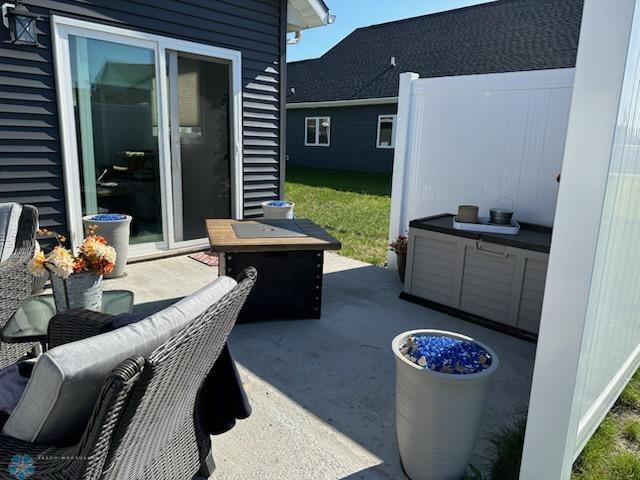 view of patio / terrace featuring an outdoor living space with a fire pit