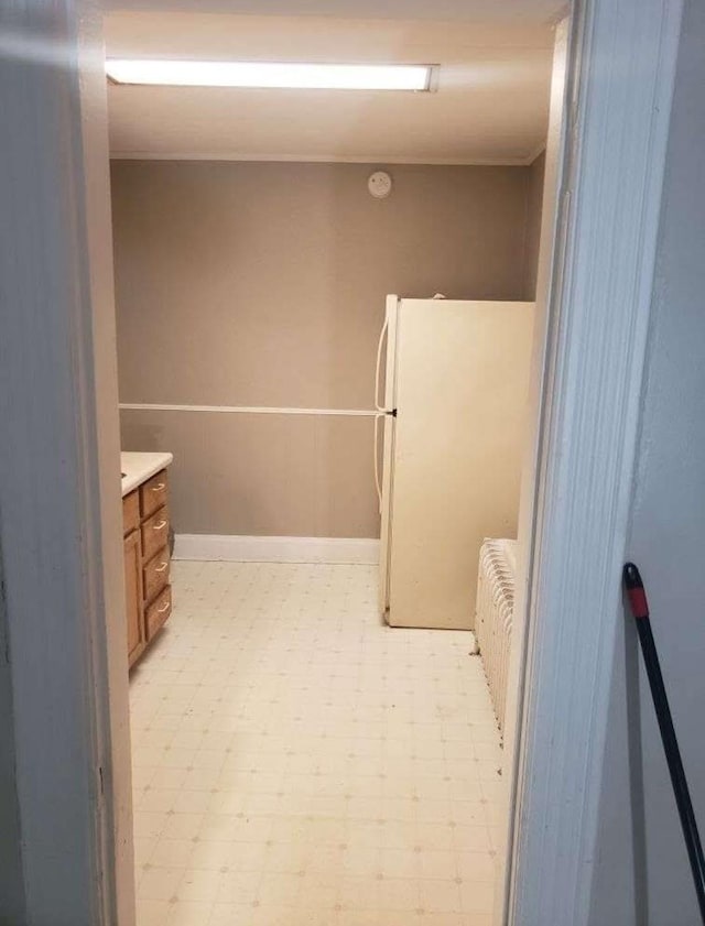 bathroom with vanity and radiator heating unit