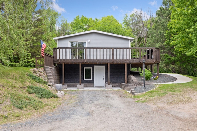 1524 Mulberry St, Taylors Falls, MN 55084 - view of front of home with a wooden deck and driveway