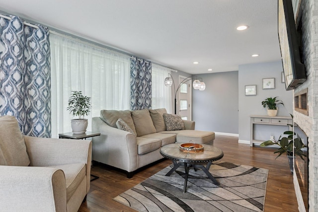 1524 Mulberry St, Taylors Falls, MN 55084 - living area featuring a fireplace, baseboards, wood finished floors, and recessed lighting