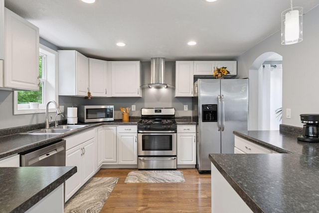1524 Mulberry St, Taylors Falls, MN 55084 - kitchen with wall chimney exhaust hood, appliances with stainless steel finishes, a sink, white cabinets, and recessed lighting