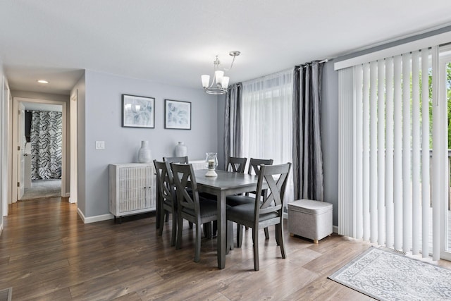 1524 Mulberry St, Taylors Falls, MN 55084 - dining room featuring a chandelier, wood finished floors, and baseboards