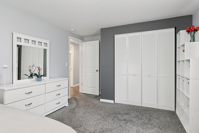 1524 Mulberry St, Taylors Falls, MN 55084 - bedroom with dark carpet, a closet, and baseboards