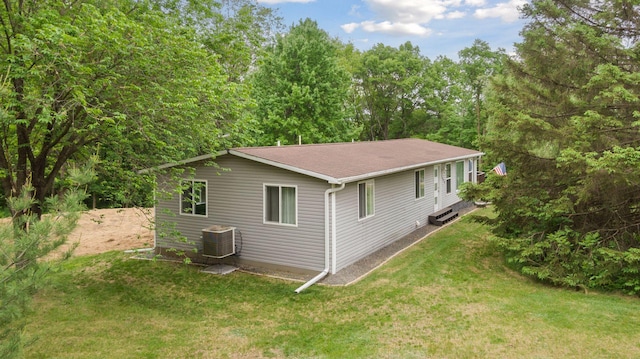 1524 Mulberry St, Taylors Falls, MN 55084 - view of home's exterior with central AC unit and a yard
