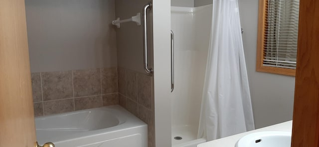 bathroom with sink and curtained shower