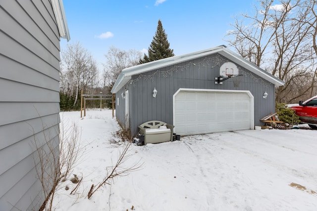 view of snow covered garage