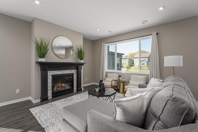 living room featuring dark hardwood / wood-style floors and a fireplace