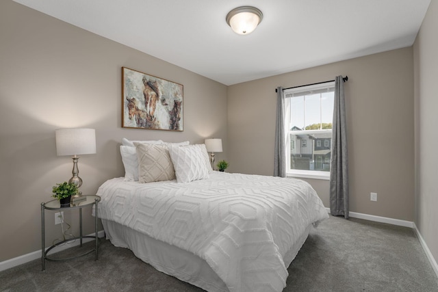 bedroom featuring dark carpet