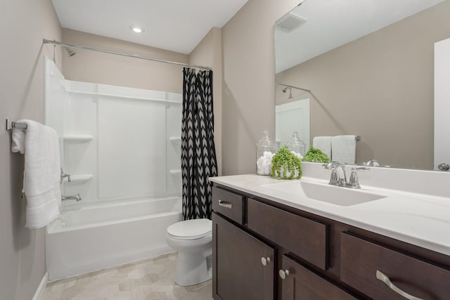 full bathroom featuring vanity, shower / bath combination with curtain, and toilet