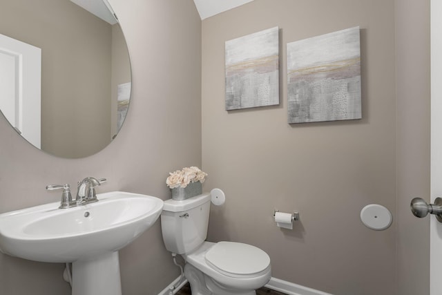 bathroom featuring sink and toilet