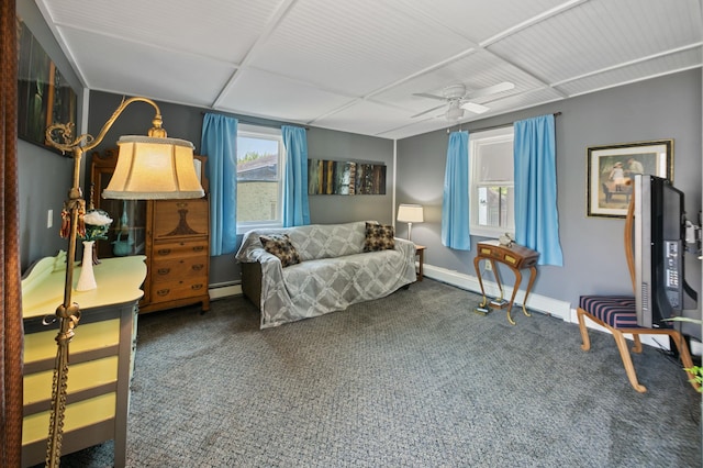 sitting room with dark carpet, a baseboard radiator, and ceiling fan