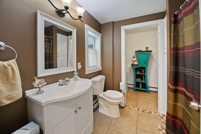 bathroom featuring tile patterned flooring, vanity, a baseboard radiator, and toilet