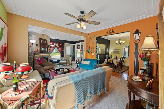 living room with crown molding, ceiling fan with notable chandelier, light hardwood / wood-style flooring, and a wall unit AC