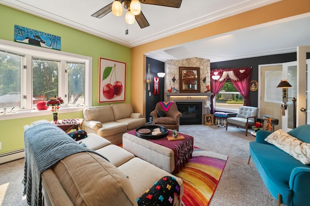 carpeted living room with a fireplace, ceiling fan, and baseboard heating