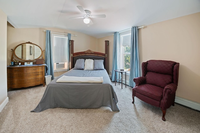 bedroom featuring lofted ceiling, a baseboard heating unit, light colored carpet, and ceiling fan