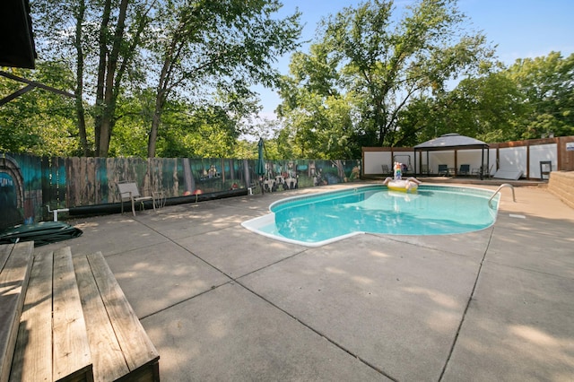 view of pool featuring a gazebo and a patio area