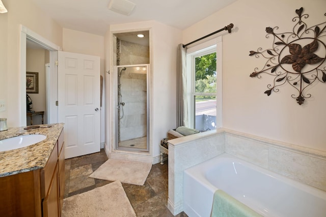 304 Main St S, Saint Michael, MN 55376 - bathroom featuring a shower stall, a garden tub, vanity, and stone finish flooring