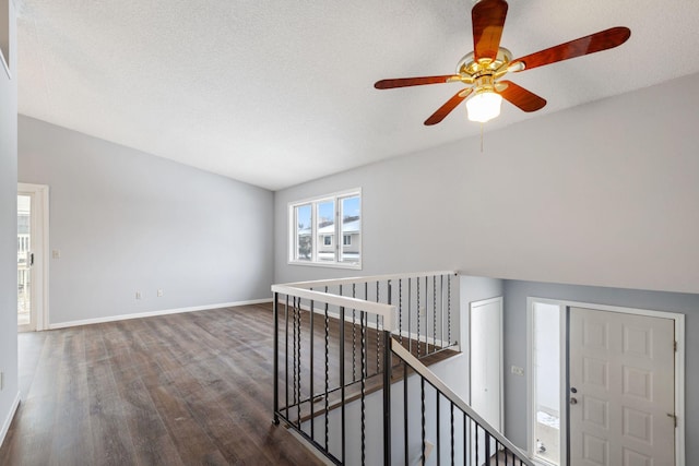 interior space featuring dark hardwood / wood-style flooring and a textured ceiling