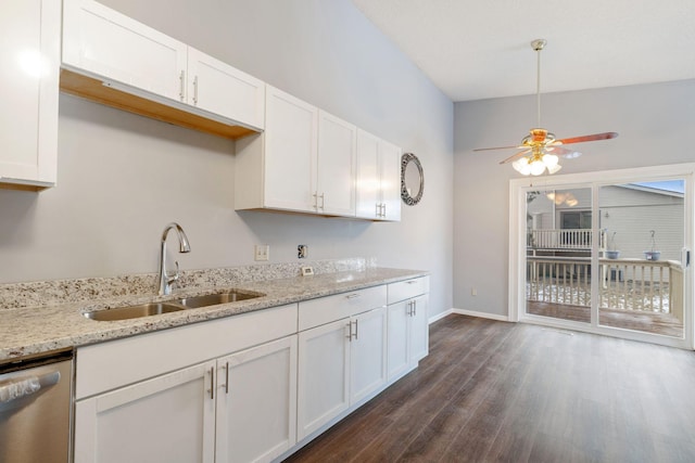 kitchen featuring white cabinetry, dishwasher, sink, and light stone counters