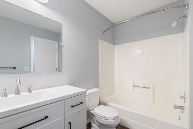 full bathroom featuring  shower combination, toilet, and vanity