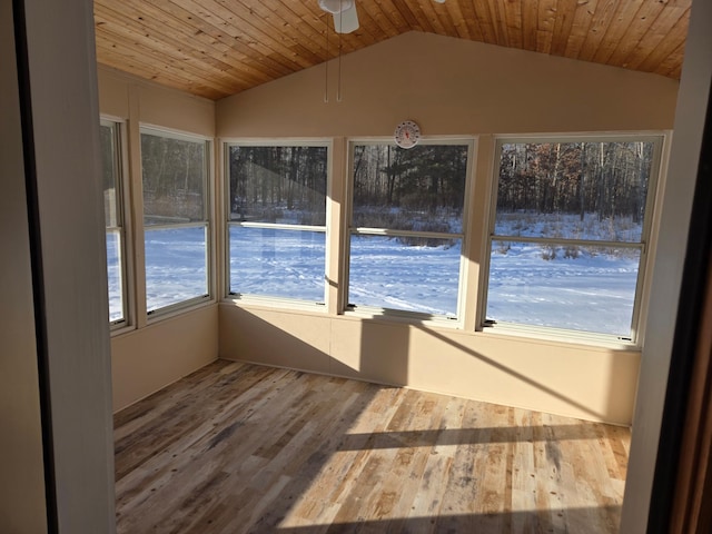 unfurnished sunroom with lofted ceiling, wooden ceiling, and ceiling fan