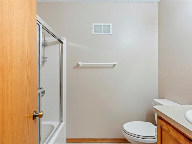 full bathroom with shower / bath combination with glass door, vanity, and toilet