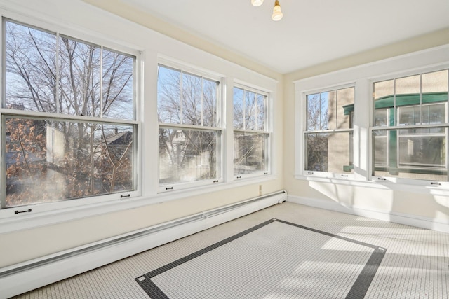 unfurnished sunroom featuring a baseboard radiator