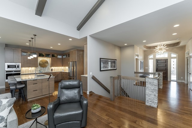 living area with baseboards, high vaulted ceiling, beam ceiling, recessed lighting, and dark wood-style flooring