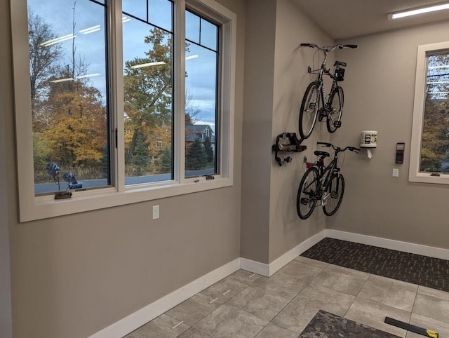 interior space featuring tile patterned floors and baseboards