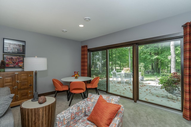 carpeted dining room with recessed lighting and baseboards