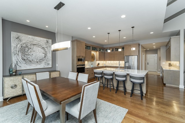 dining area featuring recessed lighting and dark wood-type flooring