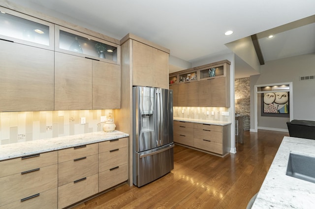 kitchen featuring stainless steel fridge with ice dispenser, light brown cabinetry, modern cabinets, dark wood-style floors, and recessed lighting