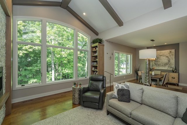 living area featuring baseboards and wood finished floors